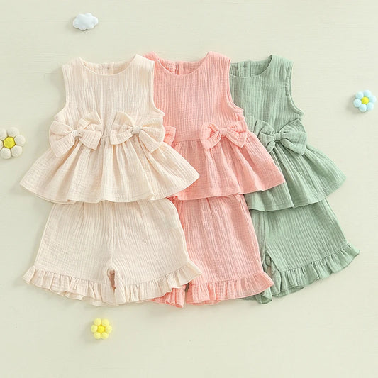 Lioraitiin Toddler Girl Summer Clothes Solid Color Bow Round Neck Tank Tops + Elastic Waist Ruffled Shorts Set